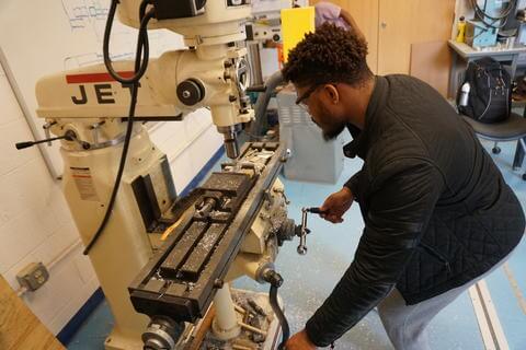 Mechanical engineering student in lab