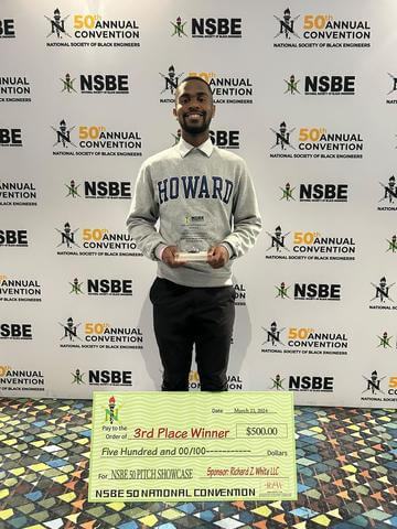 Charlie Seigler with prize at NSBE 50