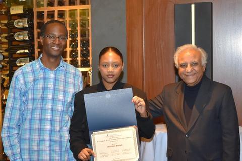 Guerodye Joseph pictured with ChE faculty members Ymele-Leki and Chawla