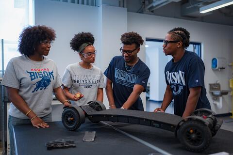 Mechanical engineering students working on project