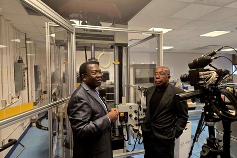 Owolabi and Glakpe demonstrating equipment